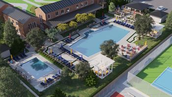 an aerial view of the pool area of an apartment complex